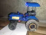 Rc tractor home made 1 hour playing time and it have smoke mashine