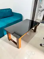 Wooden table 2 by 4 feet with glass