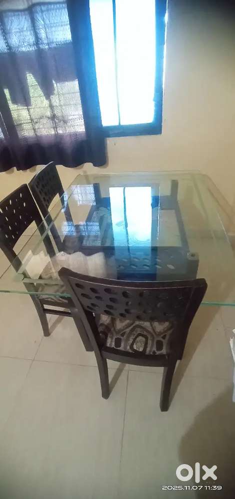 Dining set with table, 3 chairs, and 3 free chair covers