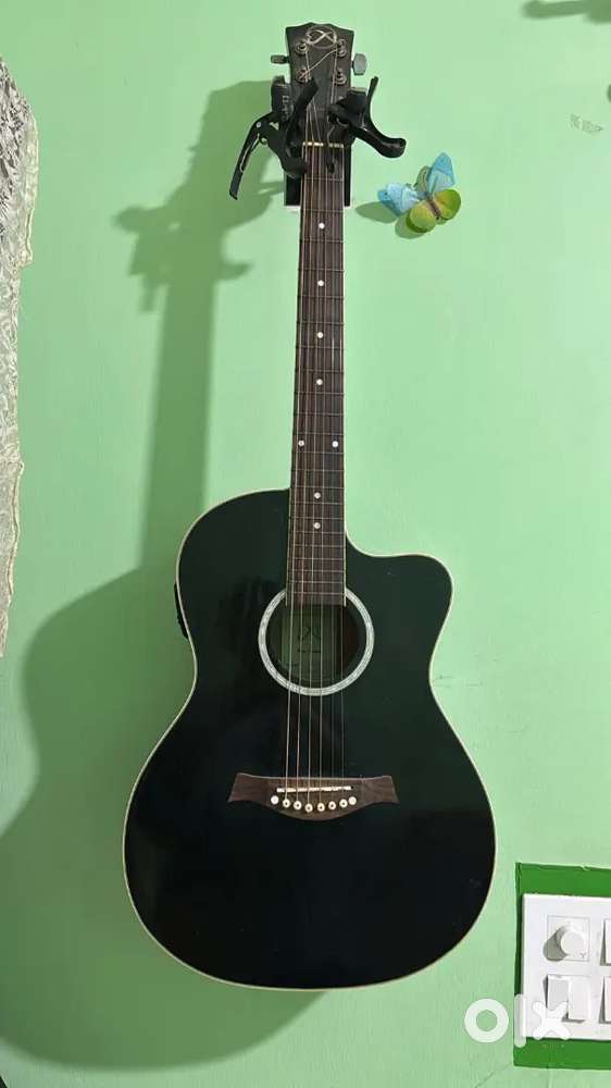 semi acoustic guitar with a leather bag