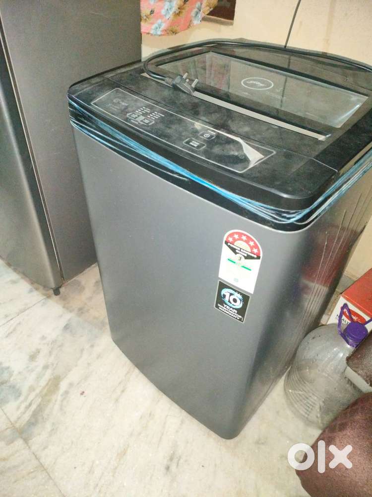 Godrej washing machine. Used less than a year. Cover included.