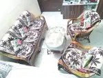 A sofa set with table and gadda.