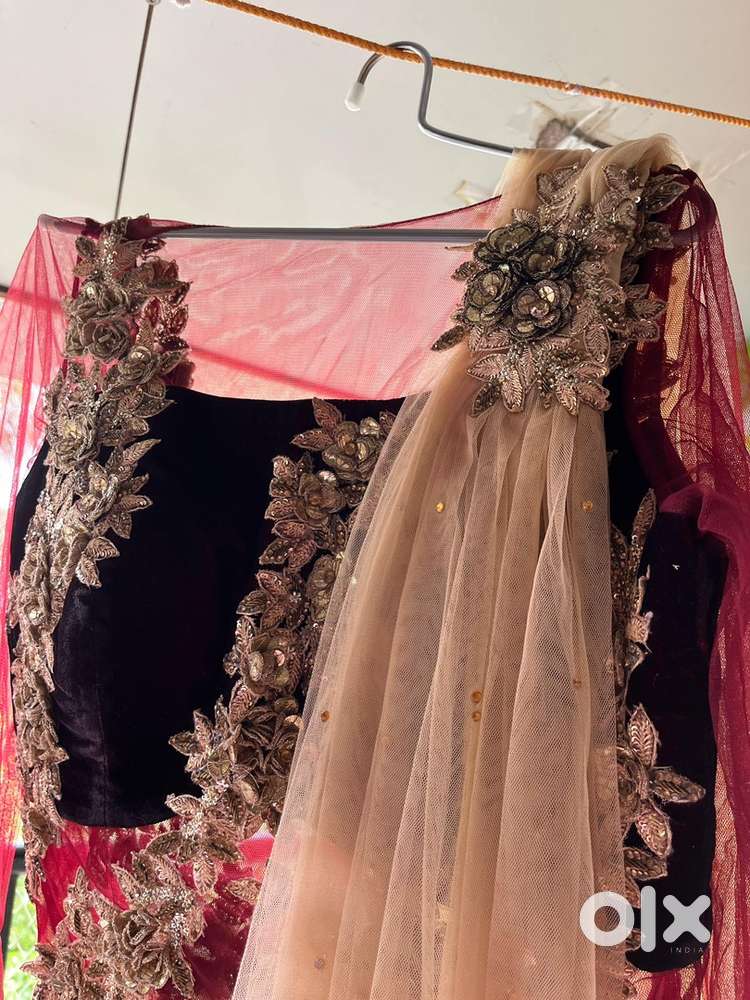 Elegant designer gown with velvet and net detailing