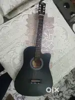 Intern black acoustic guitar