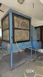 A 8.5 feet height cooler with a functioning motor and 24 inch GEC fan