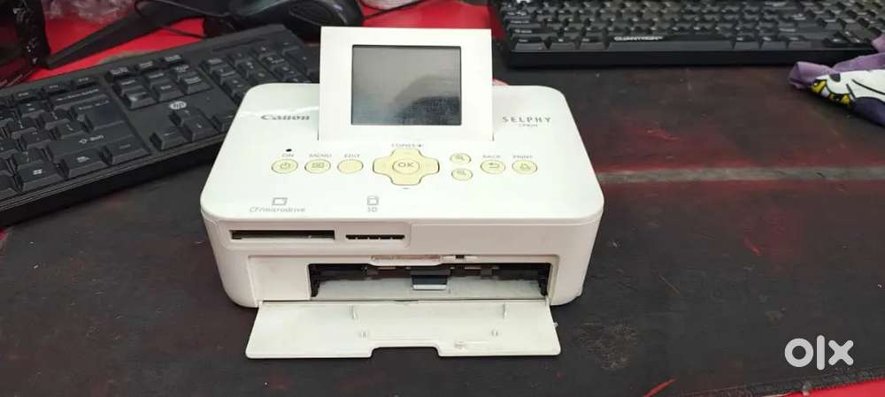 Canon selphy CP1000 with (1 Cartridge, photo paper set )