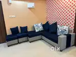 RHS L shaped 5 seater sofa with cushions and two puffy seaters