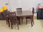 Solid wood dining table with four chairs