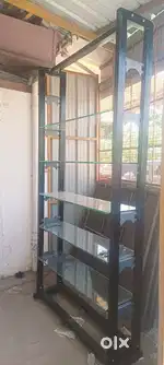 RACK FOR SALE 7FT WITH SIX ADJUSTABLE GLASS SHELFS