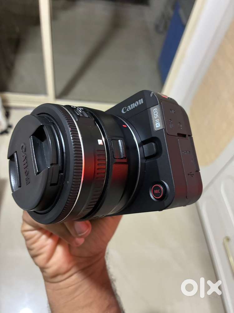 Canon R50V with adapter and lens