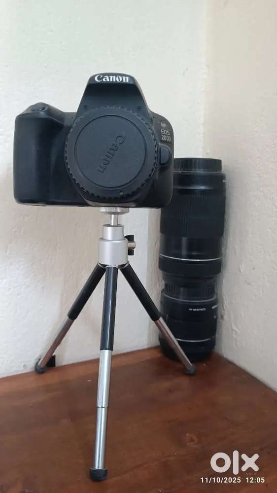 Camera 200D with Tripod and 2 lens of 70k selling @ 50K