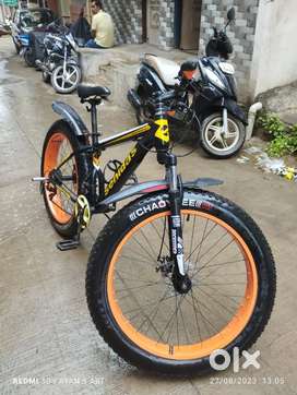 Fat bike with orange alloy. 21 gears