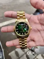 Rolex day date golden colour