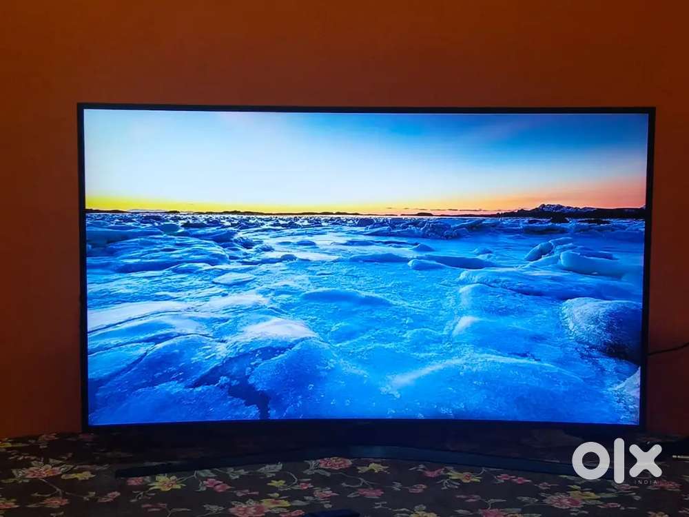 Curved smart TV with table stand nd remote