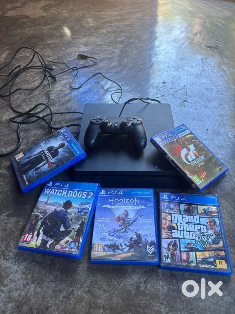 Sony Ps 4 with controller and 5 games