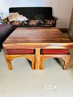 center table set, which includes the main table and 4 matching seats
