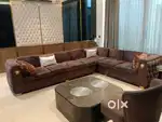 Luxurious brown Sofa with chair and marble table