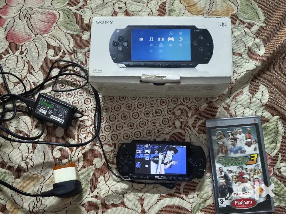 PSP 1000 model with box and games