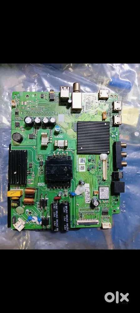 The image displays a Haier LED TV original motherboard. 