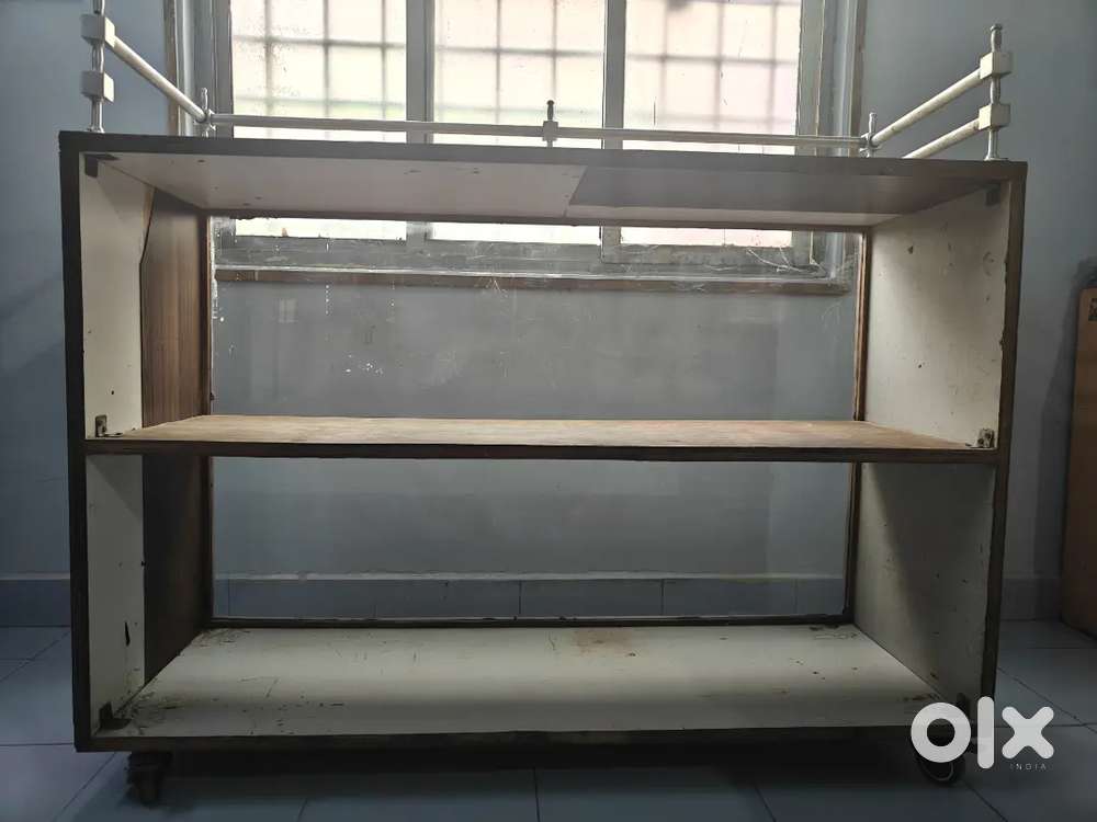 Display table with glass front and wheels