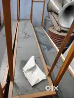 Bench , desk, office chair , podium and white board .