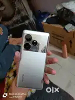 Realme GT 6 (2 months old)With bill box charger as new.