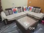 L shape sofa, central Table along with puffies