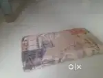 The image shows a wallet or clutch featuring a print