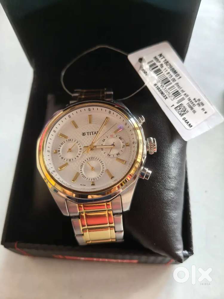 New Titan watch very good condition showroom fees