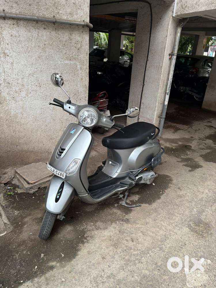 A properly used Vespa for sale.