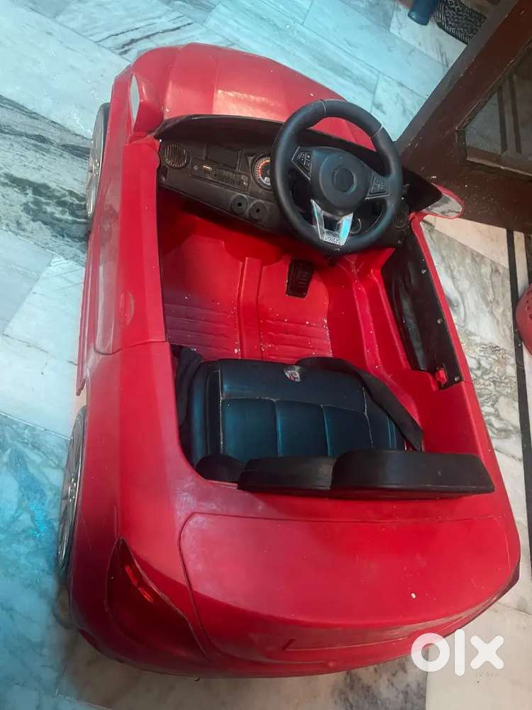 baby car.red in colour ..only 1500