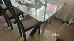 Used glass table top dining table with 6 chaira