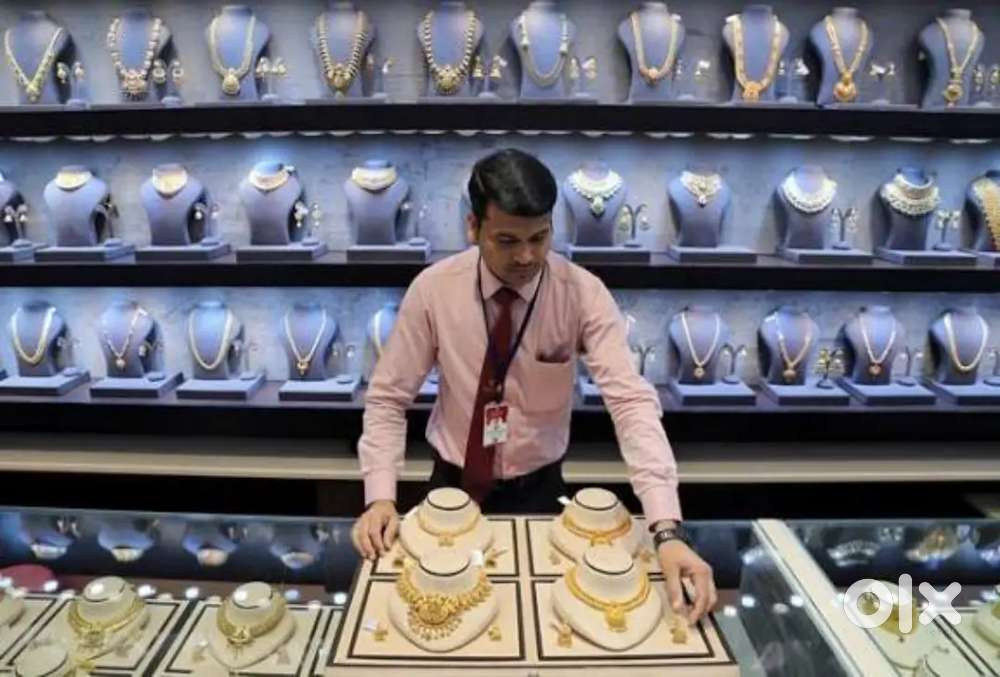 Gold jewellery showroom sales man and girls