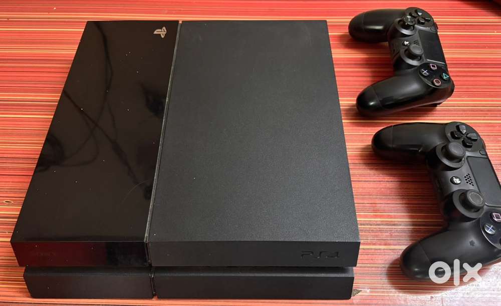 PS4 Fat 1TB  2× Original DualShock 4 controllers Excellent Condition
