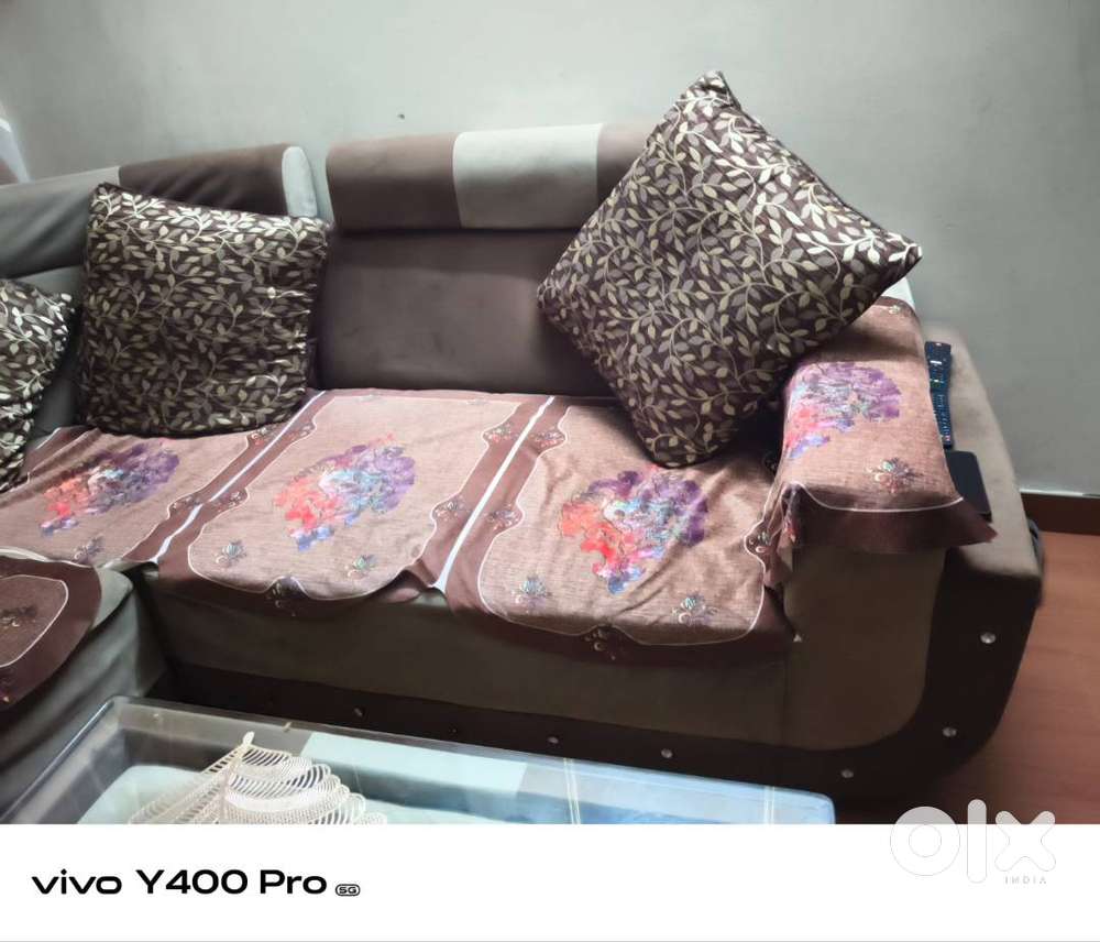 L shape sofa set with table available for sale.