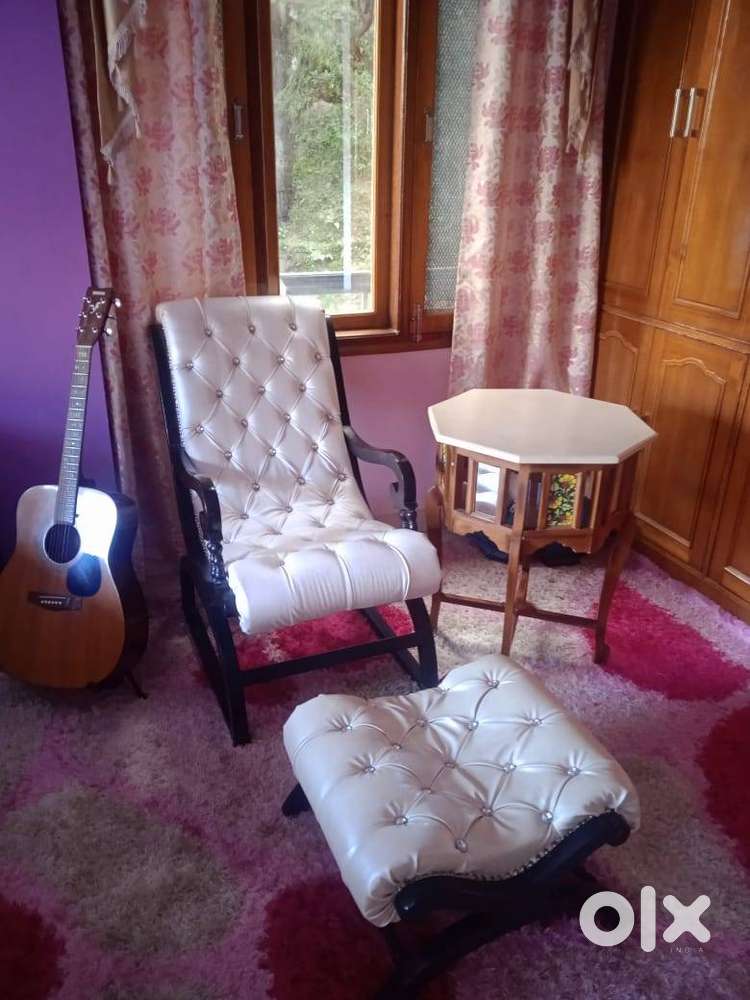 Resting chair with marble console and foot rest