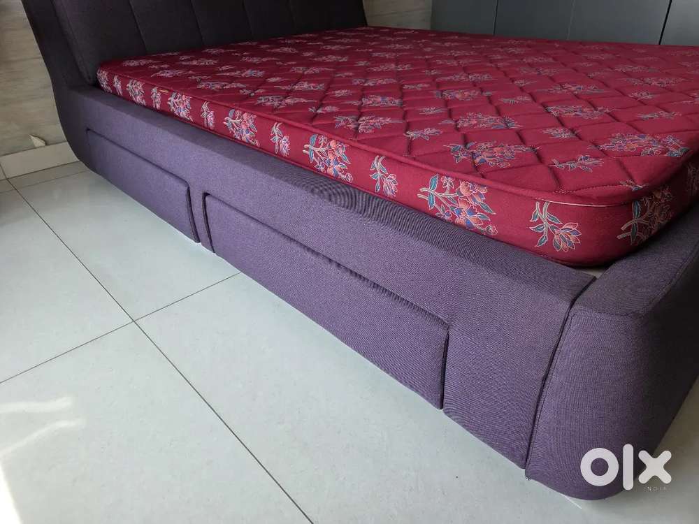 Bed with storage and mattress.