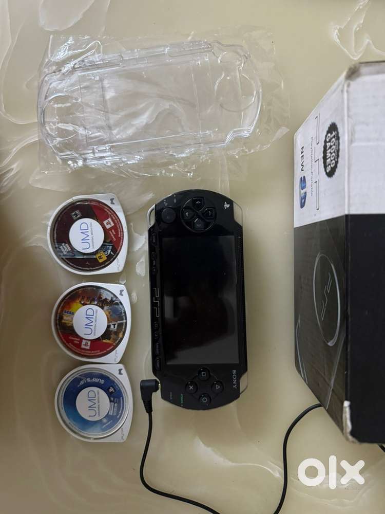 PSP Sony 1000 with Clear Case and 3 UMD