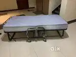 NEW COT WITH FOLDING BED (UN USED)