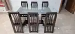 A Dining table with chairs for 6 person