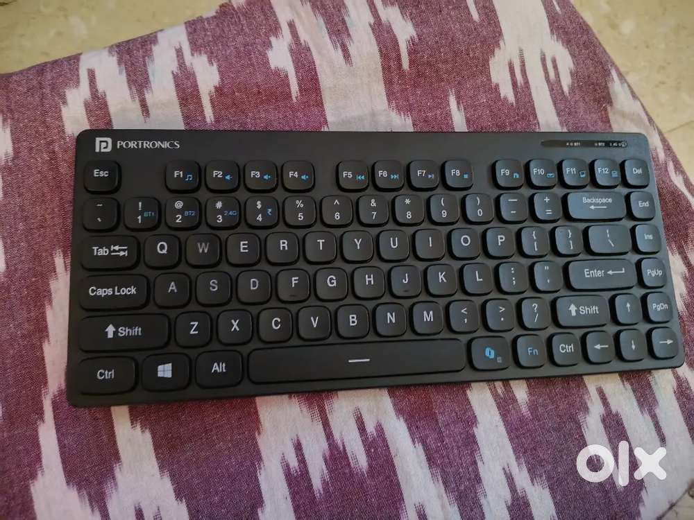 Portronics Wireless Keyboard along with it's reciever,2battery,stand.