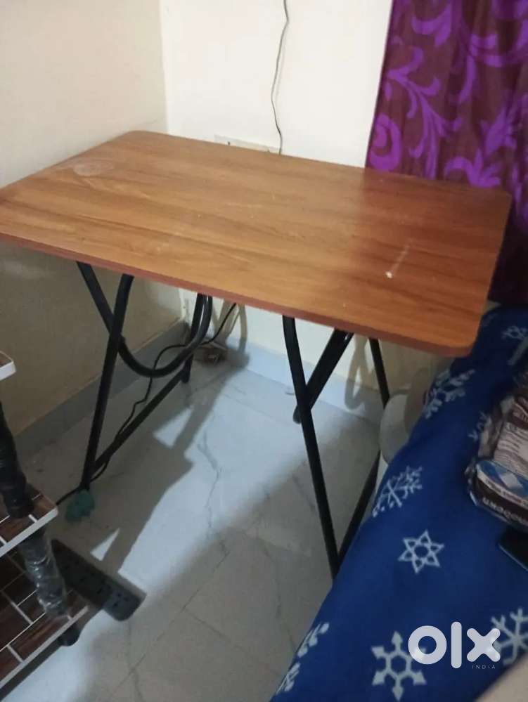 One table and one chair ,fridge stand one wood bed 6*4
