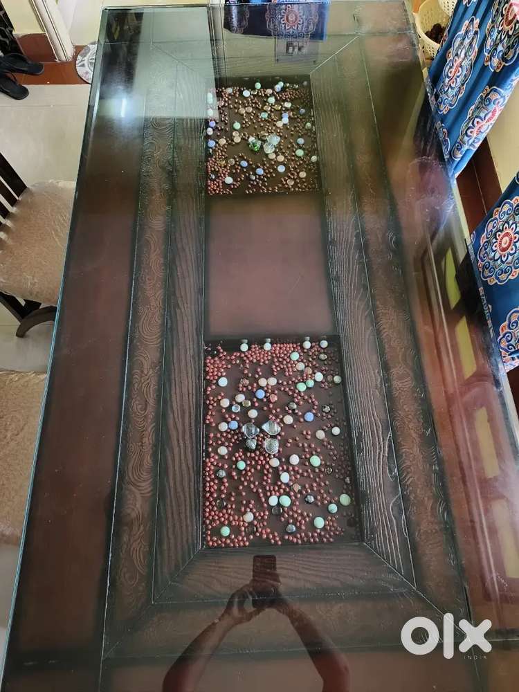 Dinning table 6 seater 6 -7 months old (pure wood)and well furnished .