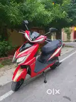 Red blossom colour electric scooty..