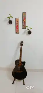 Yamaha FX100 guitar along with stand and cover