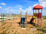 A SAFETY COMPOUND WALL VOLLEYBALL COURT