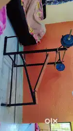 Adjustable Weight Bench which includes 3 rods and 4 plates of weights
