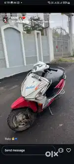 Red and white colour scooty