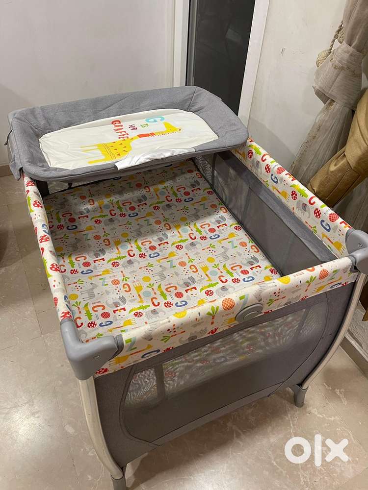 Mother care crib with diaper change station and playpen