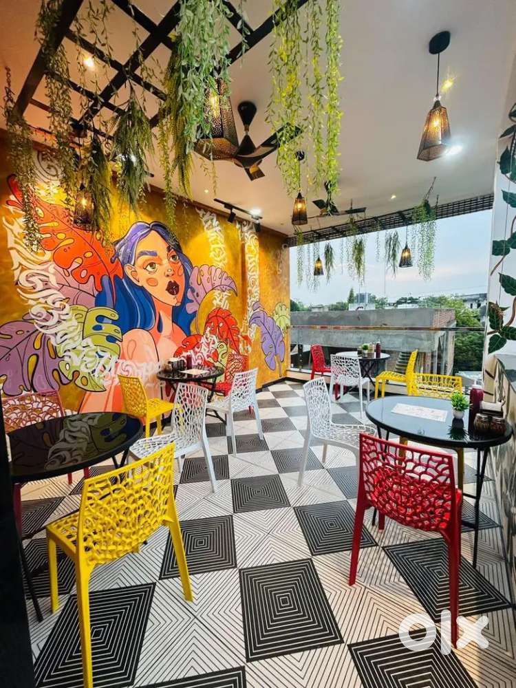 Service staff and kitchen chef for cafe .